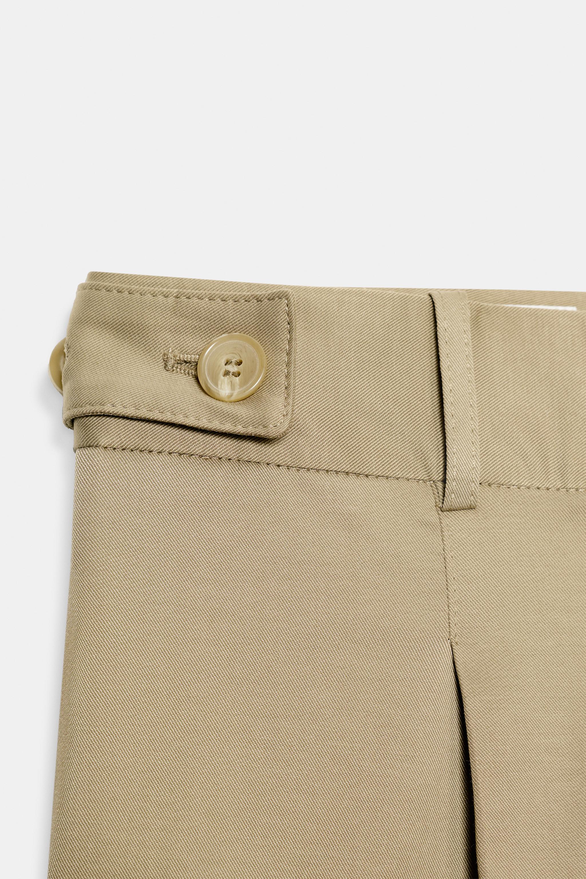 PANTALON TAILLE BASSE À PASSANTS LATÉRAUX